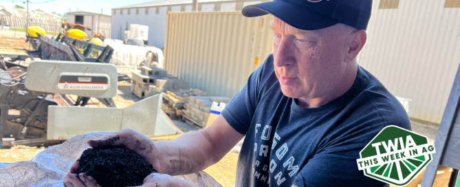 A mid shot of author Fred Nichols wearing a Huma hat and holding dry humates in his hands.