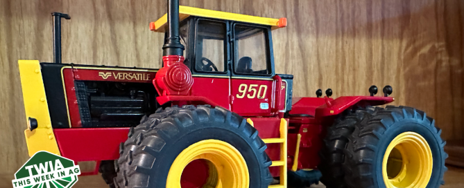 A photo of a red and yellow toy tractor.